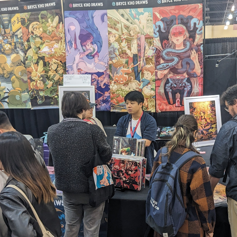 Bryce Kho at his stall surrounded by his art