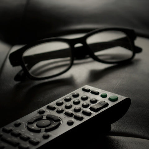img-glasses-tv-remote-on-couch