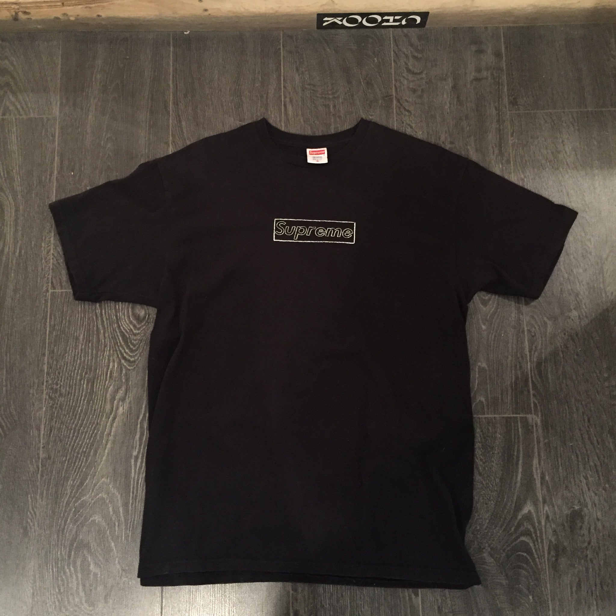 supreme kaws tee