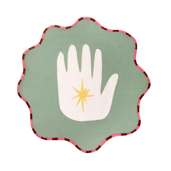 An individual pack-shot image of the green and white hand placemat. | © Pangea 2024