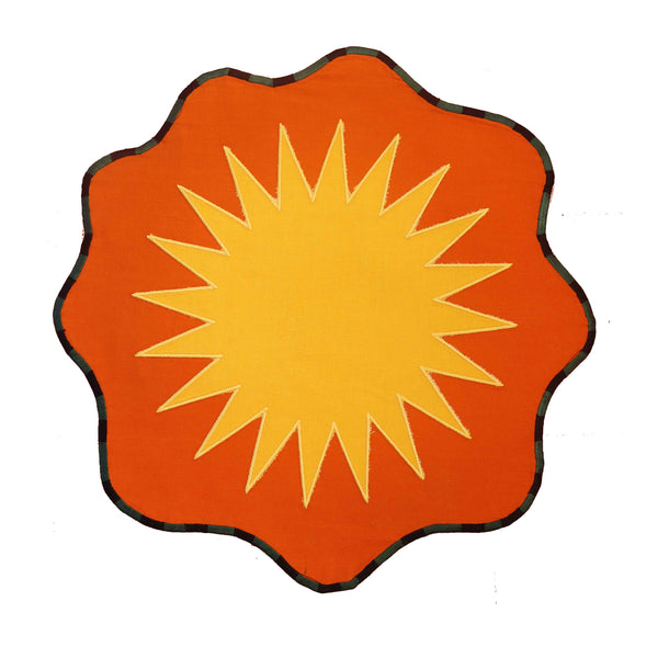 An individual pack-shot image of the orange and yellow sun placemat. | © Pangea 2024