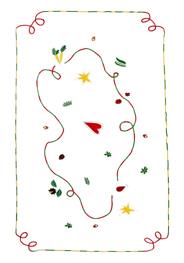 The white tablecloth has Christmas themed items embroidered on it: red heart, green leaves, green beans, carrots, chesnuts, chicken/turkey drumstick, a bright star and a red and green swirl covering the entire middle section. | © Pangea 2024