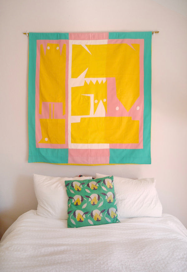 The flag is hanging on a wall above a bed. | © Pangea 2024