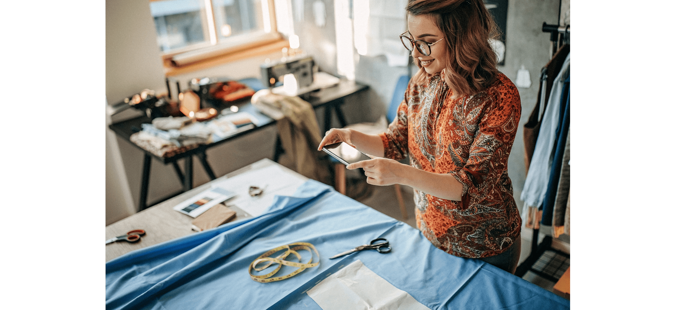 Woman taking a photo for etsy of clothing