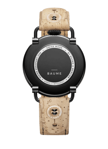 TWO NEW BAUMES FOR MEN AND FOR WOMEN  Two new BAUME watches, with Small Seconds and Date functions and quartz movements, join the collection.  With a streamlined round case in black PVD steel equipped with a crown at 12 o’clock and articulated lugs characteristic of the BAUME collection, this new model asserts a sports aesthetic for men with a 41 mm dial in satin-finished slate-gray with a white minute track, a strap in natural cork with black overstitching – interchangeable simply by pushing a button –, and a black pin buckle.  The very elegant feminine version features a 35 mm 5N PVD steel case with a white opaline dial, a black minute track, and an interchangeable black cotton strap with a natural cork lining and a pin buckle. Both models are water-resistant to 3 ATM (approximately 30m).