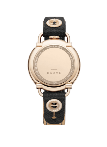 TWO NEW BAUMES FOR MEN AND FOR WOMEN  Two new BAUME watches, with Small Seconds and Date functions and quartz movements, join the collection.  With a streamlined round case in black PVD steel equipped with a crown at 12 o’clock and articulated lugs characteristic of the BAUME collection, this new model asserts a sports aesthetic for men with a 41 mm dial in satin-finished slate-gray with a white minute track, a strap in natural cork with black overstitching – interchangeable simply by pushing a button –, and a black pin buckle.  The very elegant feminine version features a 35 mm 5N PVD steel case with a white opaline dial, a black minute track, and an interchangeable black cotton strap with a natural cork lining and a pin buckle. Both models are water-resistant to 3 ATM (approximately 30m).