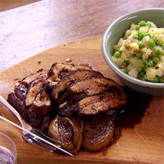 Jerk pork belly with pea and potato mash-up