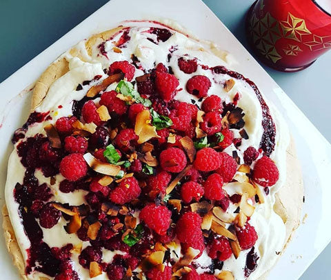 pavlova with pomegranate and berry coulis