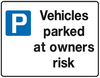 vehicles parked at owners own risk sign