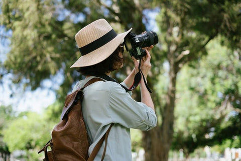 A person shooting outdoors with their digital camera