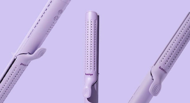 Three white flat irons on a purple background.