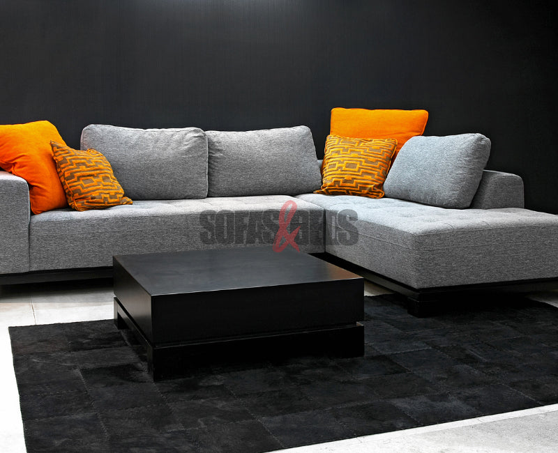 Grey sofa styled with orange cushions |Sofas & Beds