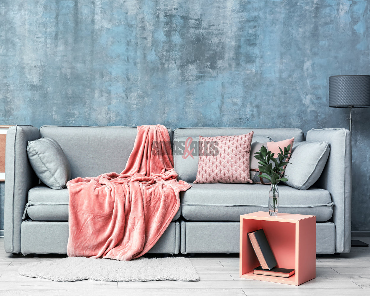 A grey sofa in pink background | Sofas & Beds