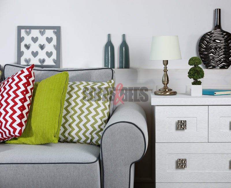 Grey sofa styled in lime coloured cushions | Sofas & Beds