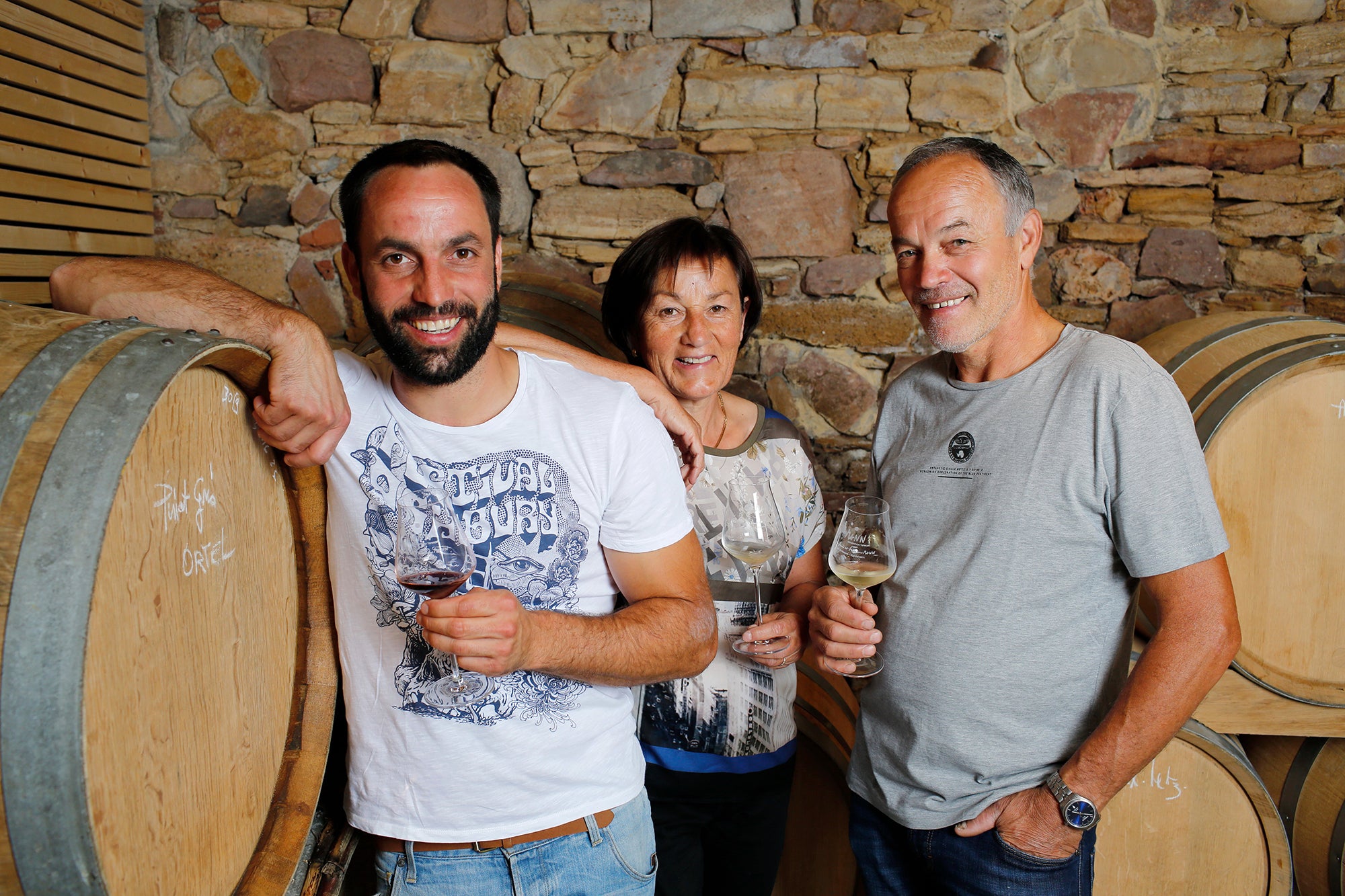 Sébastien Mann and his parents in their cellar.