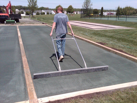 Proper brooming of bocce court