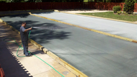 Watering a Har-Tru bocce court