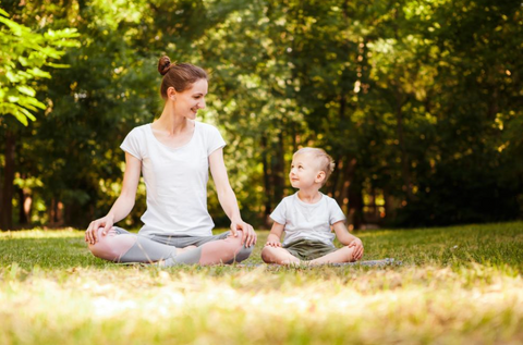 Mother and Son practicing mindfulness in the park