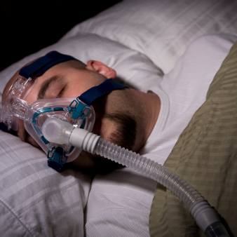 Man Sleeping With Cpap Machine From The Sleep Institute