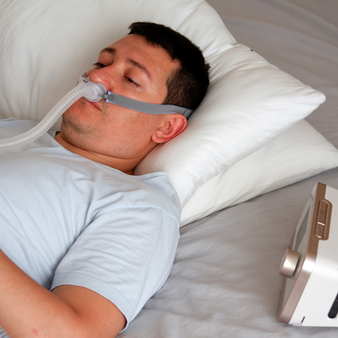 Man Using A Cpap Mask From The Sleep Institute