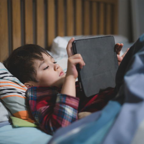 Child Looking At Tablet Not Sleeping