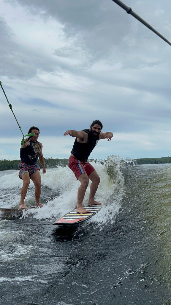 Anthony surfs a wake