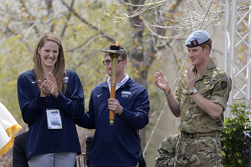 U.S. Navy Lt. Brad Snyder along with Prince Harry and four time Olympic Gold Medalist Missy Franklin after lighting the cauldron to signify the start of the 2013 Warrior Games.