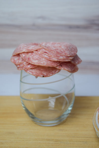 building salami rose with wine glass