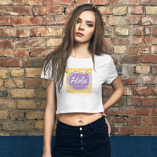 Load image into Gallery viewer, A young white woman with dark brown hair is wearing a Hola white colored Casual Crop Top paired with black denim. She is facing to the front, standing infront of a red brick wall
