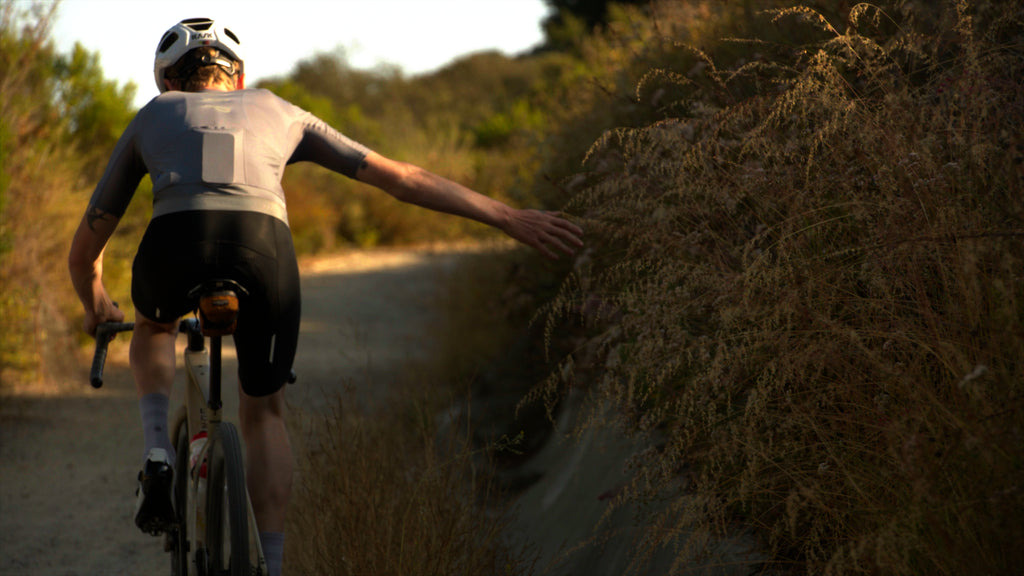 ALMSTHRE cycling saddle bag attached to the ENVE MOG bike's seat post. The Cali Gold saddle bag is securely fastened beneath the seat, providing convenient storage for cycling essentials.