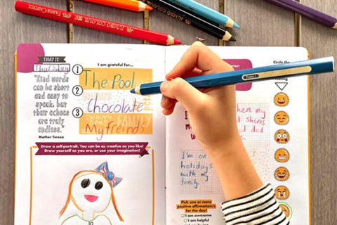 a child using the grow journal, a gratitude journal for kids and teens