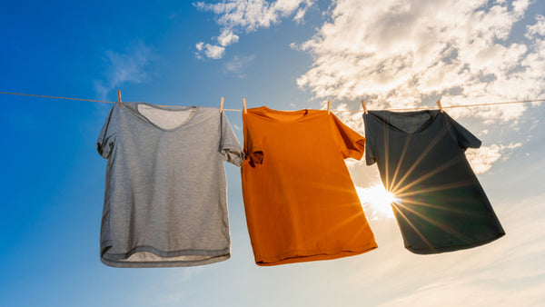 3 t shirts drying in the sun