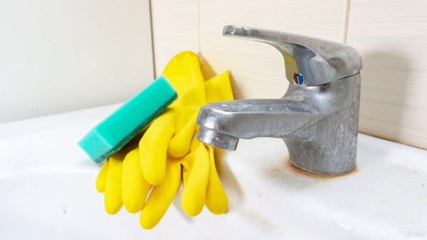 gloves and sponge to clean dirty tap