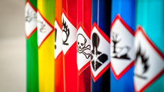 bright chemicals with warning signs