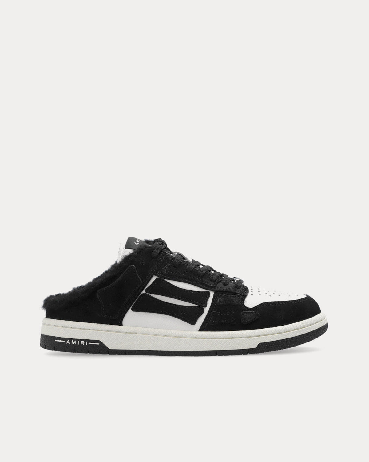 https://cdn.shopify.com/s/files/1/0493/5663/6318/products/amiri-SKELTOPMULESHEARLING-black-low-top-sneakers-1.jpg?v=1677160761