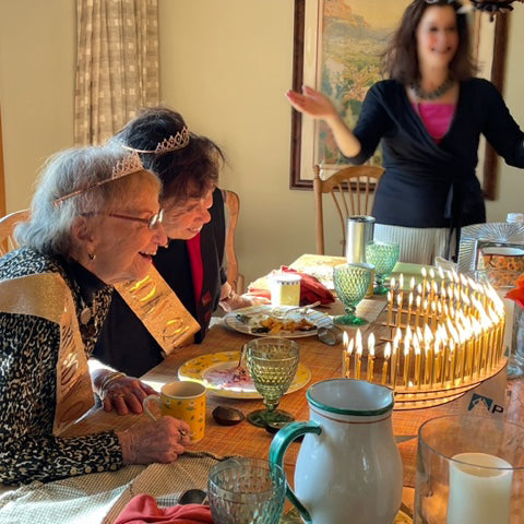 Joint 94th birthday celebration for two long, long-time friends, 94 lit birthday candles to blow out