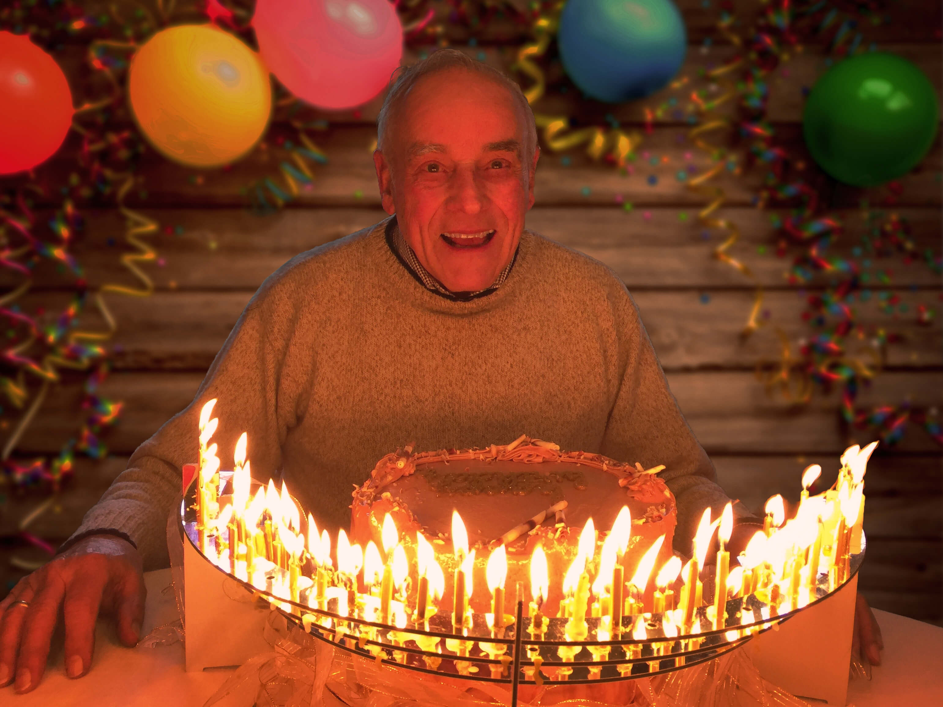 Enjoying his 80th birthday, Knight Merritt, inventor of the Celebration Stadium birthday candle holder.