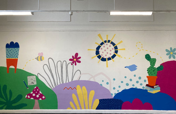 primary school mural in library featuring bright shapes and colours