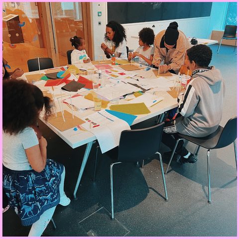 STEM workshop in a classroom at the museum. Children drawing their own spaces.