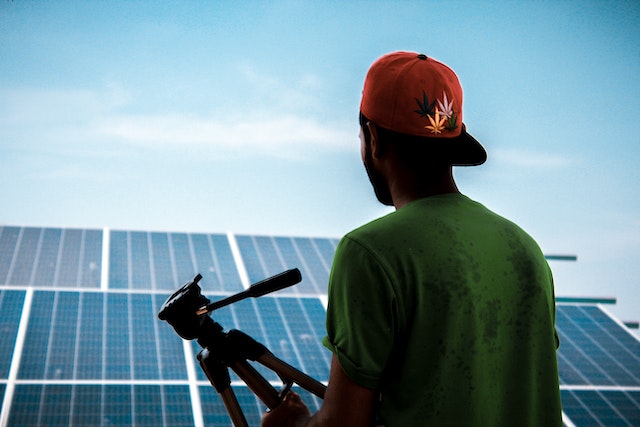 person-looking-at-solar-panels