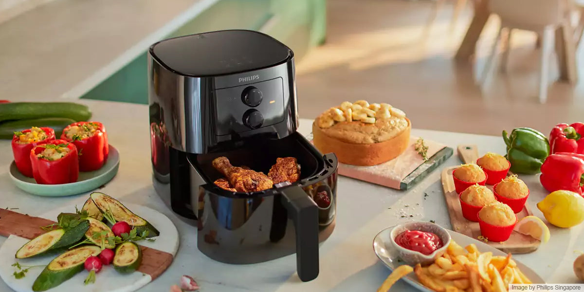 black airfryer with healthy foods on the table