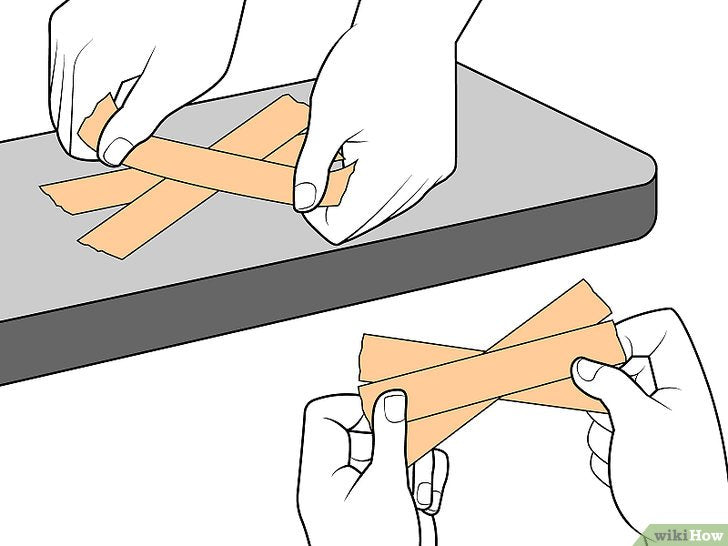 Bước 5: Băng hình quạt là một kỹ thuật quấn băng để bảo vệ cổ tay khỏi chấn thương.