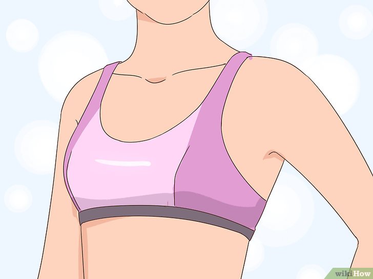 Bước 1: Cho bé gái mặc thử áo ngực thể thao trước.
