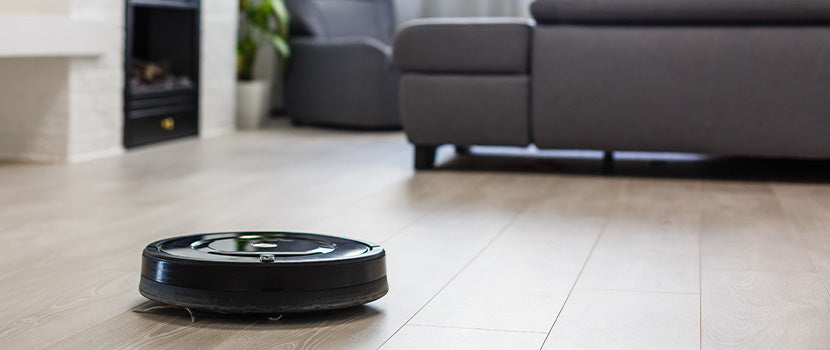 A robot vacuum cleaning the home automatically.