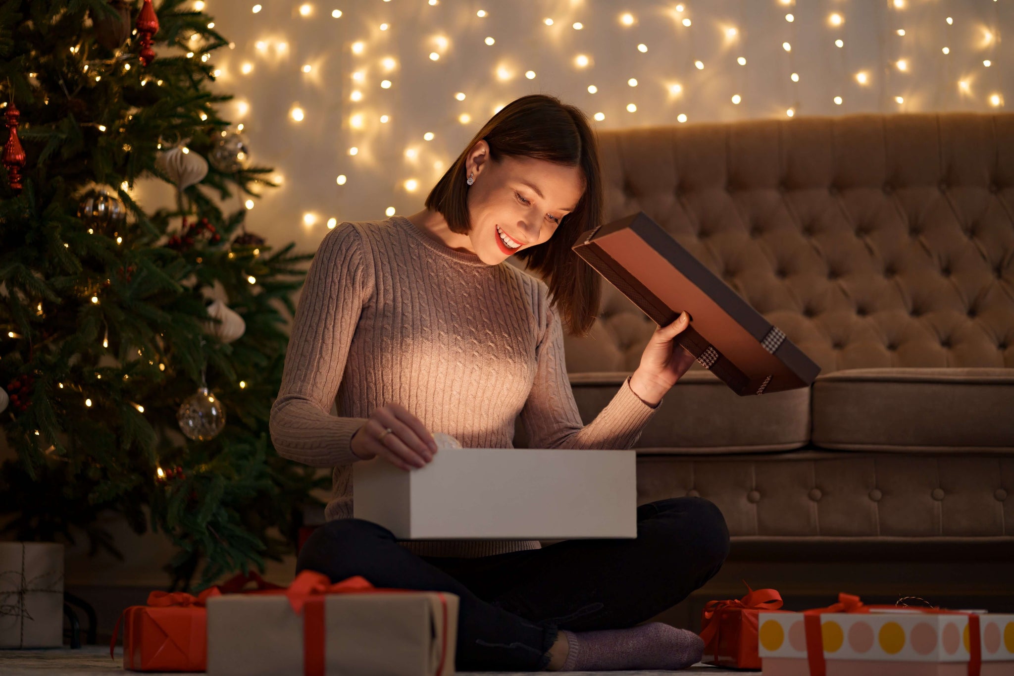 Woman opens christmas gift