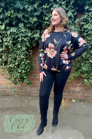 Plus size floral jumper and skinny jeans