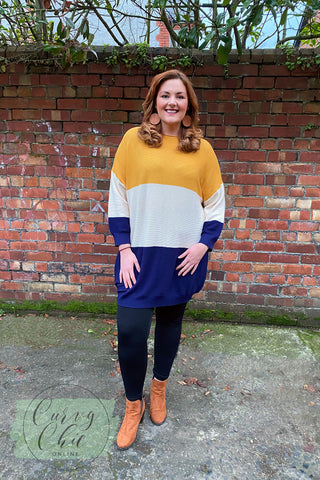 mustard yellow and navy jumper dress with wooden circle earrings