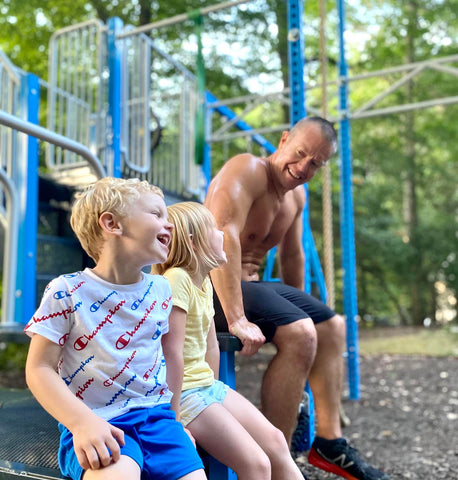 Dad and Kids laugh and have fun on SwingSesh after a workout
