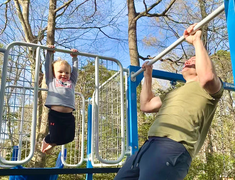 Father and son doing pull ups and hanging on a SwingSesh