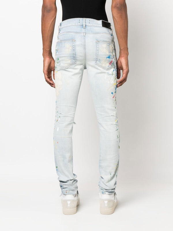 AMIRI distressed logo-print skinny jeans – TOPDROP-NEWYORK
